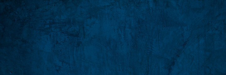 Texture of a old grungy blue concrete wall with cracks as a background or wallpaper