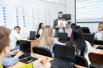 Driving instructor asking students about the traffic sign