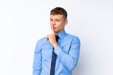 Young handsome businessman doing silence gesture