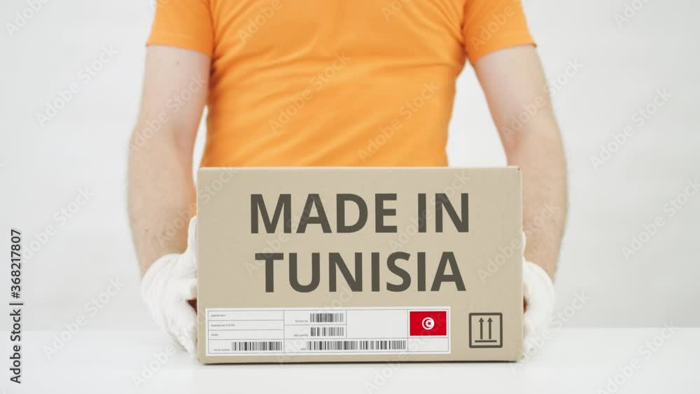 Poster box with made in tunisia text being placed on the table