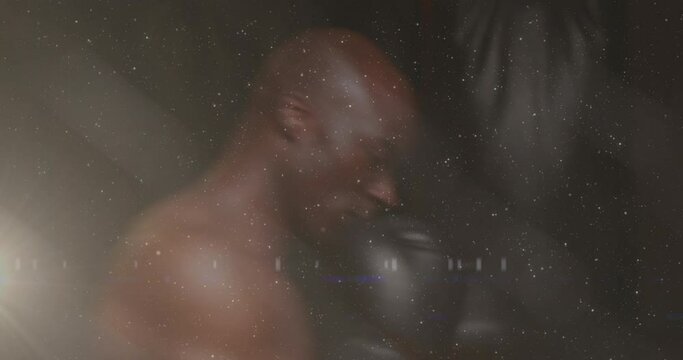 Animation of mixed race man boxing with glowing light in the foreground