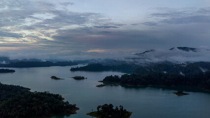 Aerial view of Kenyir Lake during blue hour sunrise.