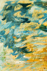 Abstract creative background of chaotic strokes of old cracked paint on concrete wall. Old surface with traces of paint, weathered, scratches and cracks for design