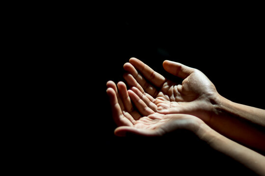 A man his praying hand for God's blessing To ask for your help In a state of depression from the kovid-19, he was affected both physically and mentally,and hope that everything would be well soon.