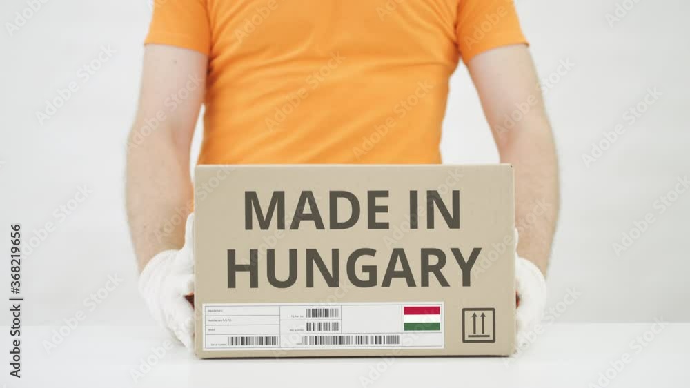 Poster box with made in hungary text being placed on the table