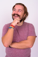 Portrait of happy bearded man with mustache and long hair