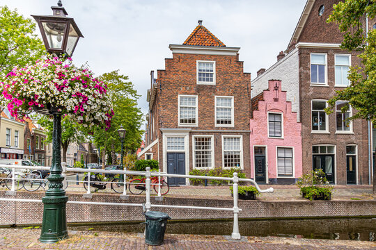 Cityscape Leiden street view with typical Dutch gable houses and canal in the old city centrer of Leiden in the Netherlands