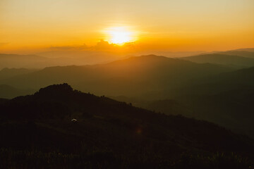 Obraz premium View of silhouatte of mountain range under the sky during the sunset. Beautiful evening nature background.