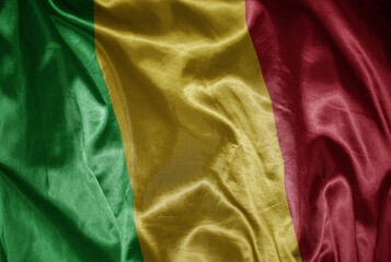 colorful shining big national flag of mali on a silky texture