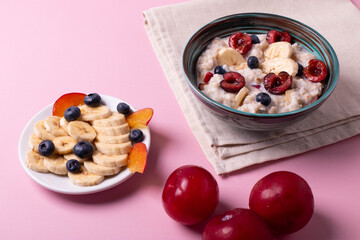 porridge, fruit and berries as healthy yummy breakfast concept