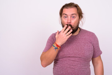 Bearded man with mustache and long hair against white background