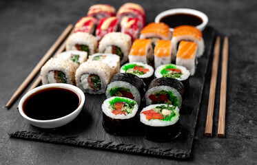 Set of sushi on a stone background. Dinner for two