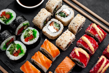 Set of sushi on a stone background. Dinner for two