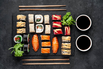 Set of sushi on a stone background. Dinner for two