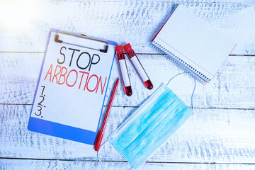 Conceptual hand writing showing Stop Arbotion. Concept meaning advocating against the practice of...