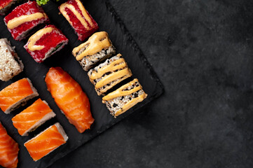 Set of sushi on a stone background with copy space for your text