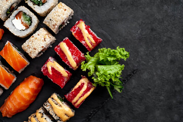 Set of sushi on a stone background with copy space for your text