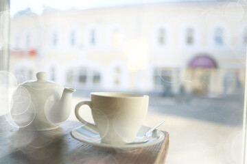 cup in an outdoor cafe / breakfast concept in a cafe, coffee, tea, morning drink