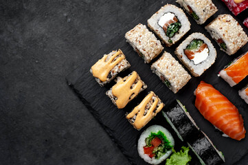 Set of sushi on a stone background with copy space for your text