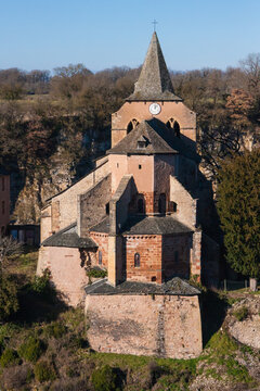 Facade of Sainte Fauste church with blue sky in Bozouls, Aveyron, France