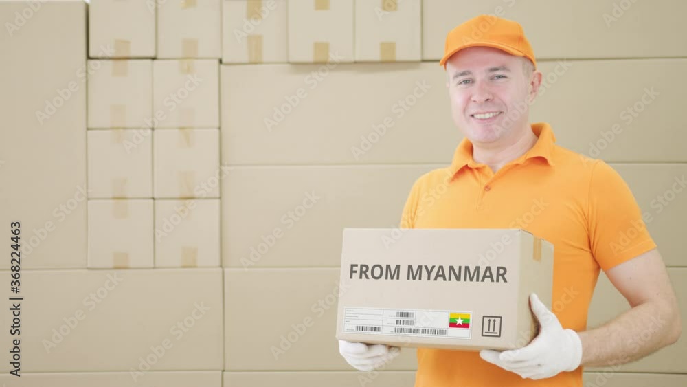 Poster man holding cardboard parcel with printed from myanmar text on it