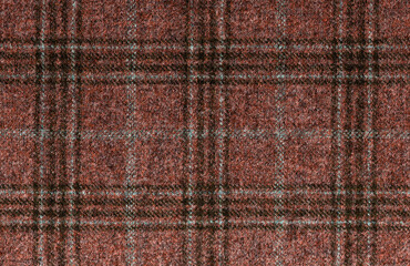 Fototapeta premium Lana vergine, cashmere. Expensive men's suit fabric. Brown Glenurquhart check is made of woolen fabric with a woven twill design of small and large checks. High resolution