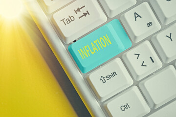 Word writing text Inflation. Business photo showcasing increase in the volume of money relative to available goods Different colored keyboard key with accessories arranged on empty copy space
