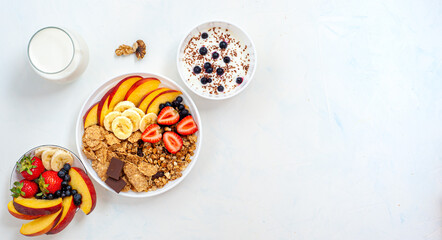 Light summer breakfast on a light background. Banner view from above.