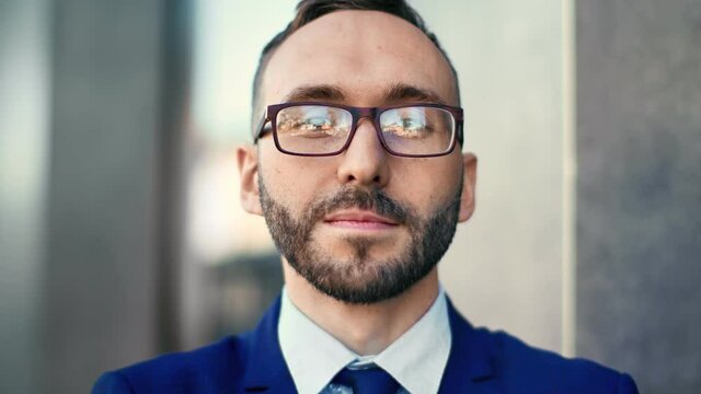Closeup face of man boss in glasses posing outdoor having positive emotion. 4k Dragon RED camera