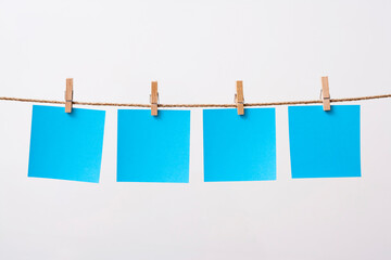 paper cards hanging rope isolated on white background
