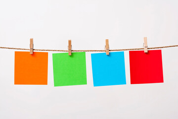 paper cards hanging rope isolated on white background
