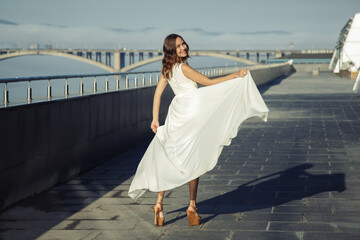 beautiful fashion woman in white fluffy dress. City Style