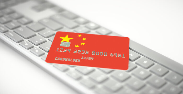 Credit card depicting flag of China on computer keyboard. Fictional numbers