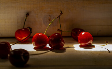 cherries inside a wooden box.