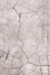 Abstract creative background of chaotic strokes of old cracked paint on concrete wall. Old surface with traces of paint, weathered, scratches and cracks for design