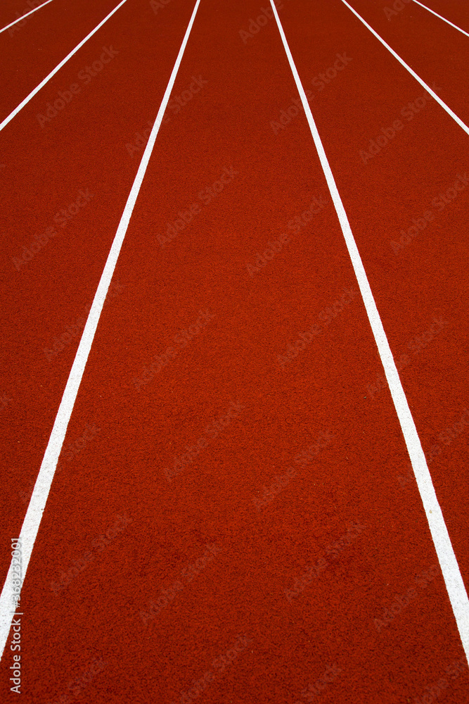 Wall mural red stadium running track closeup