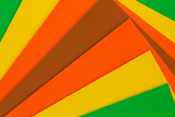 multi-colored sheets of rectangular paper, spread out on a plane