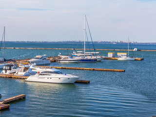 Odessa, Ukraine July 6, 2016: Yacht Club with parked vehicles of various models. Pleasure boat with...