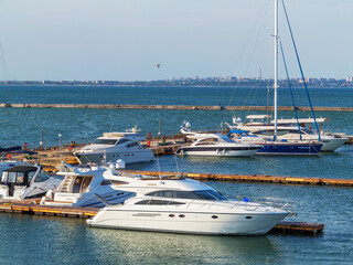 Odessa, Ukraine July 6, 2016: Yacht Club with parked vehicles of various models. Pleasure boat with...