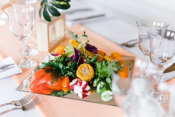 mirror plate with vegetables on the table