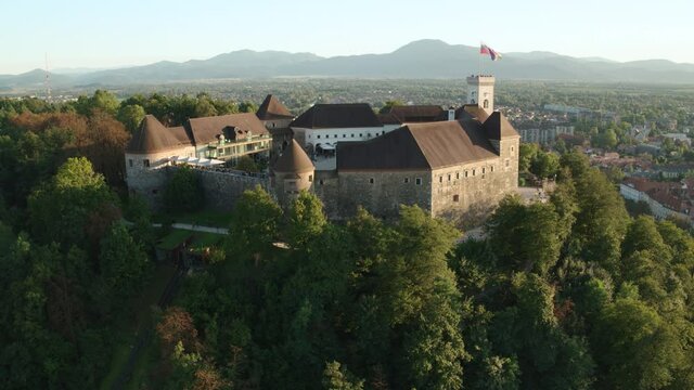 4K Drone Push Back Shot Of Castle On Hill On Sunny Day