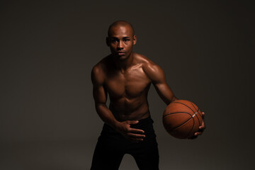 Fitness sports man playing basketball