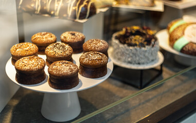 Chocolate cupcakes at the store front of patisserie.
