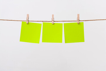 paper cards hanging rope isolated on white background
