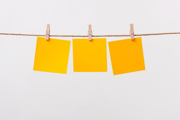 paper cards hanging rope isolated on white background
