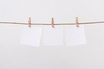 paper cards hanging rope isolated on white background
