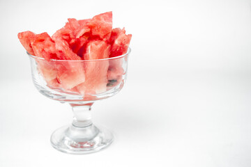 watermelon chopped pieces in a glass cup, summer fruit refreshment
