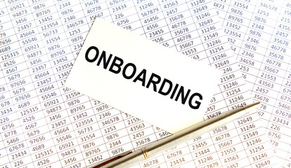 white paper with text ONBOARDING on a black background with stationery