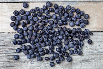 Blueberries on a white wooden background. Concept for healthy eating. Antioxidant organic superfood.