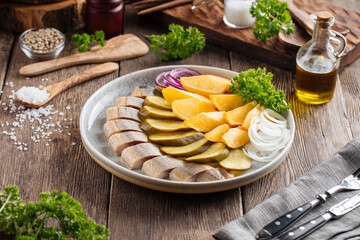 Russian platter with herring pickles and potatoes
